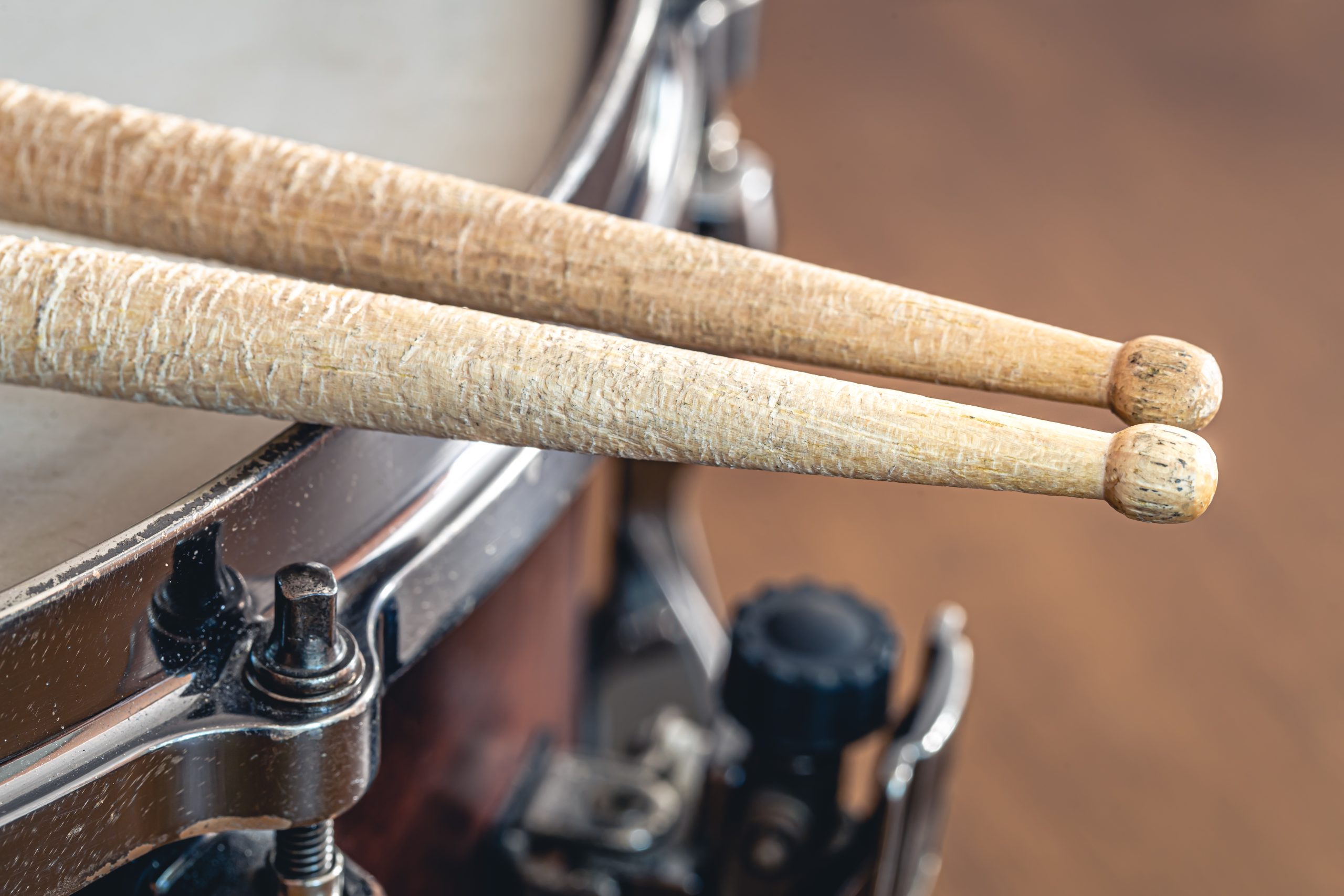 closeup drumsticks blurred background scaled